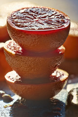Blood oranges stacked soaked in the sun