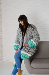 Young fashionable woman in merino wool jacket