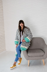 Young fashionable woman in merino wool jacket