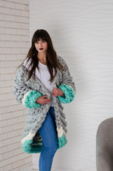Young fashionable woman in merino wool jacket