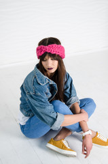 young woman in fashionable pink merino wool headband