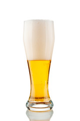 Glass of beer with foam isolated on white background