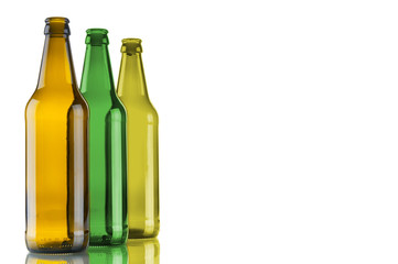 Three empty beer bottles on white background