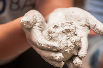 Artist holding Clay