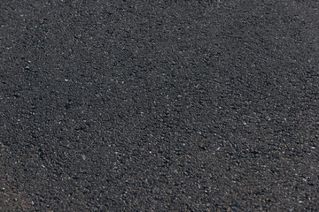 Czarna asfaltowa droga tło z masy bitumicznej 