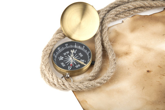 compass, old paper and rope