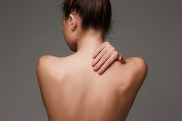 The beautiful woman's body on gray background