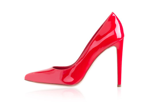 Women's red shoes from a varnish on a white background