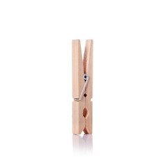 Wooden clothes pin. Studio shot isolated on white