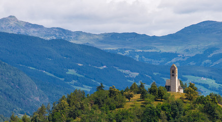 Medieval church on top of the hill, Italian Alps