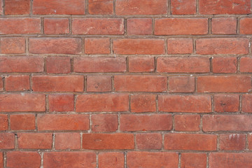 Texture of old brickwork with spots and chips on bricks.