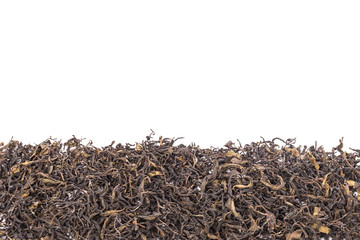 Heap of dried green tea leaf. Studio shot isolated on white
