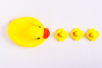 Yellow bath duck toy with little ducks