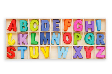 Colorful wooden alphabet in square box. Top view. Isolated on white. Saved with clipping path