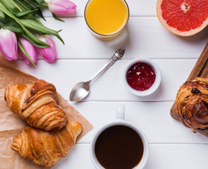 Delicious breakfst with croissants, juice and coffee