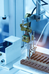 Automatic robot in assembly line working in factory. Smart factory industry 4.0 concept.