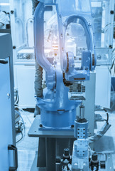 Automatic robot in assembly line working in factory. Smart factory industry 4.0 concept.