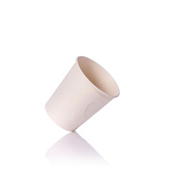 Blank white paper cup for coffee or hot drink. Studio shot isolated on white