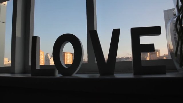 Decor word LOVE on window