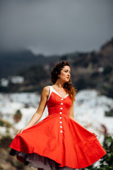 Fototapeta na wymiar beautiful happy girl in dress in Spain for holidays and modelling