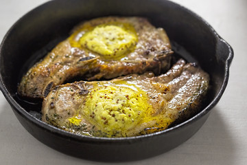 Bone in Pork loin chops with herb crust and wholegrain mustard butter