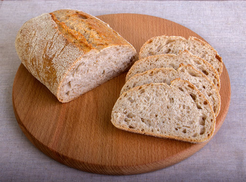 Fresh slice of white bread on a cutting board