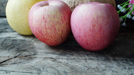 Apple on the wood table.
