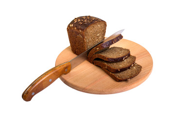 A fresh slice of bread and a cutting knife on a cutting board