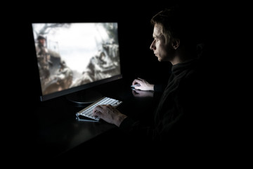 Young gamer in the dark