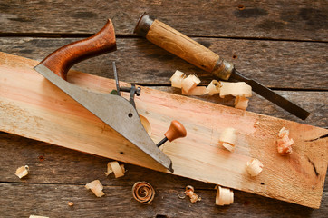 Carpenter's tool chisel, plane, on an old bench