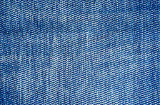 Shabby Denim Texture as Background. Texture of blue jeans textile close up. Blank backdrop for design