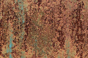 Background of Rusty metal and green paint.