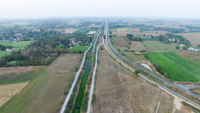 Aerial View Local Road and small Canal in brideyes one point perspective