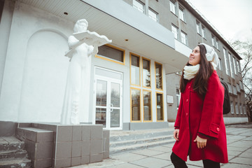 Young girl at university lisitng music