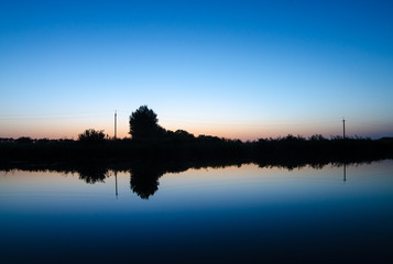 Obraz premium Mirrored sunset