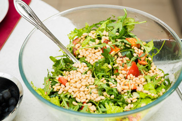 The salad with rucola and pine nuts
