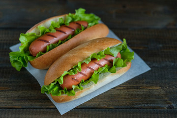 Hotdogs on a wooden board. Photo closeup.