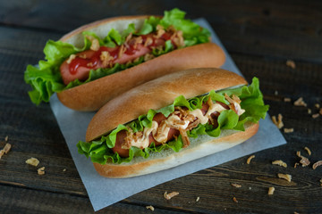Hotdogs on a wooden board. Photo closeup.