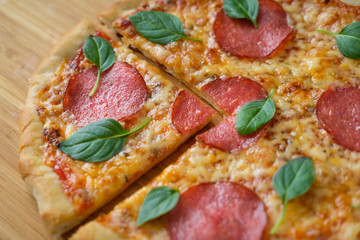 pizza with pepperoni and basil