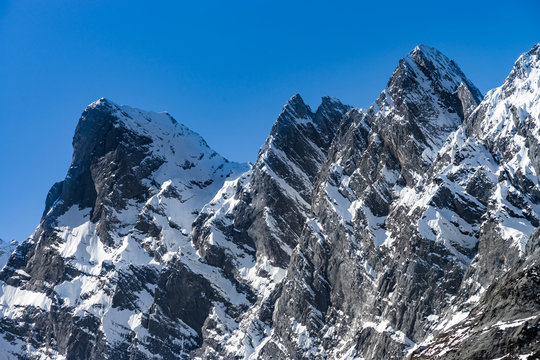 Beautiful snowy mountains, sunny day in Alps