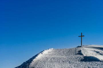 Fototapeta na wymiar Summit of the rock with big wooden cross