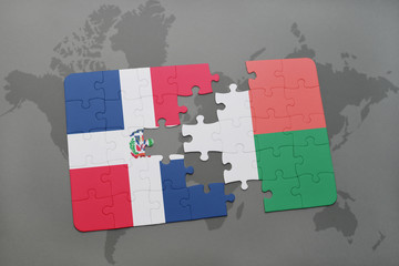 puzzle with the national flag of dominican republic and madagascar on a world map