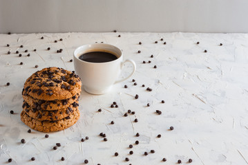 Homemade chocolate chip cookies and coffee. Chocolate crumbs.