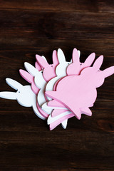 Rabbits on the old wooden background.