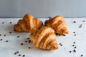 Croissant for breakfast. Chocolate crumbs.