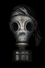 Old gas mask on a black background