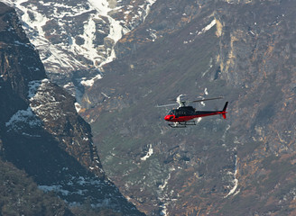 The helicopter on the way from Namche Bazar to Lukla - Nepal Himalayas - 140124345