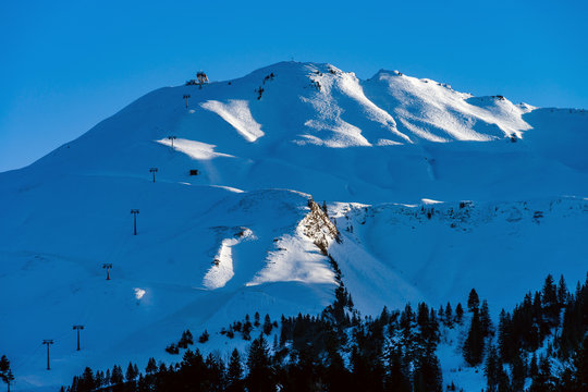 Beautiful snowy mountains, sunny day in Alps