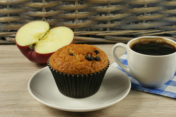 Chocolate muffins with a Cup of coffee on the table