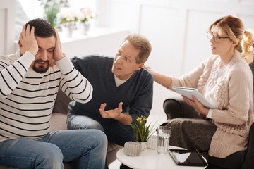 Unhappy emotional man having a quarrel with his boyfriend